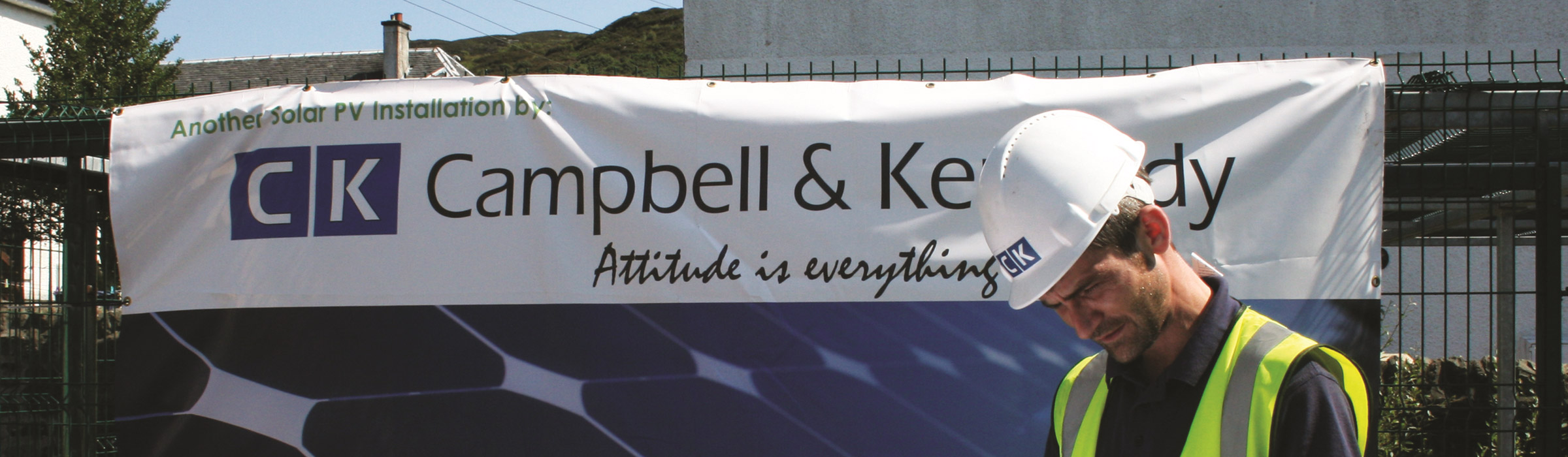 Campbell Kennedy signage with worker